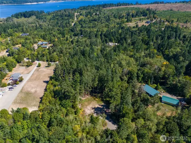 Surrounded by other large acre parcels with nicely built homes the property offers easy accessibility to Port Hadlock, Oak Bay park for beach access and more!