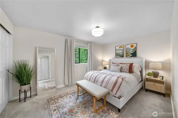 Spacious primary bedroom with roomy closet.