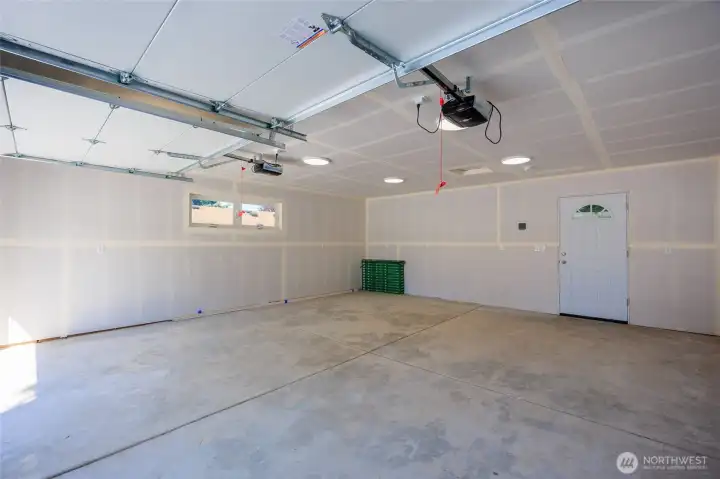 Imagine all the projects & hobbies in this expansive garage.