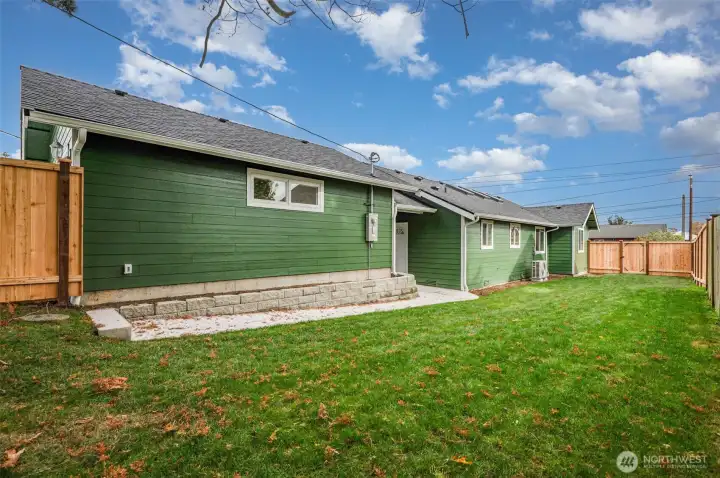 Oversized two-car garage offering a covered breezeway to the home.