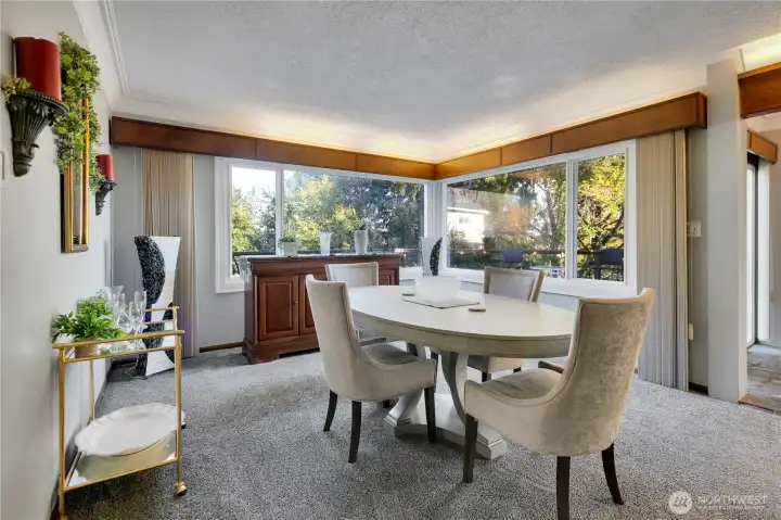 Dining room w/large windows & plenty of natural light.