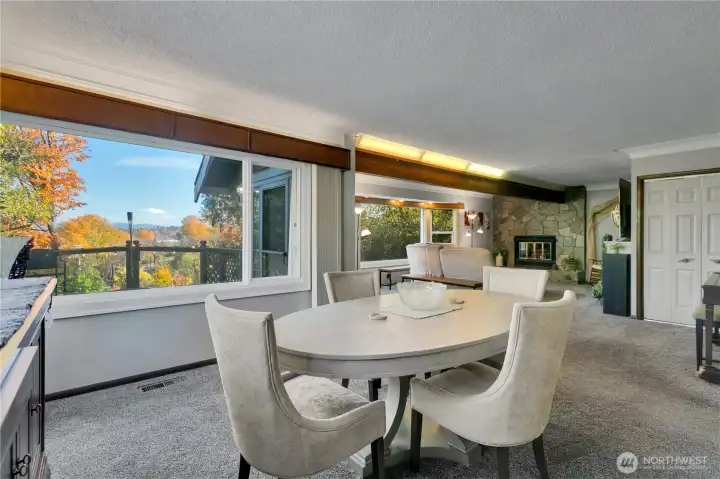 Corner view of dining room showing open flow to living area.