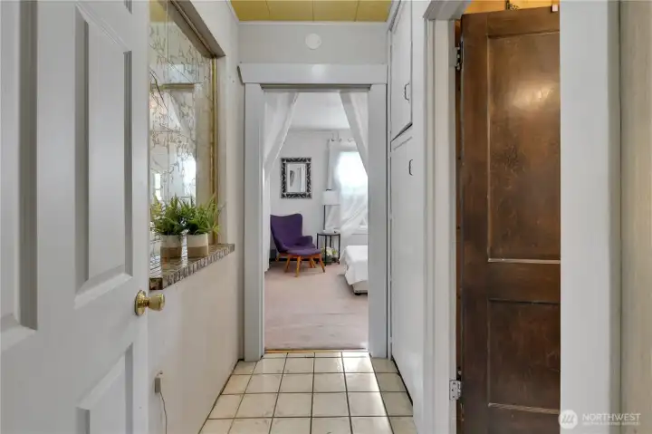 Main level hallway w/full bath on right & bedroom ahead.
