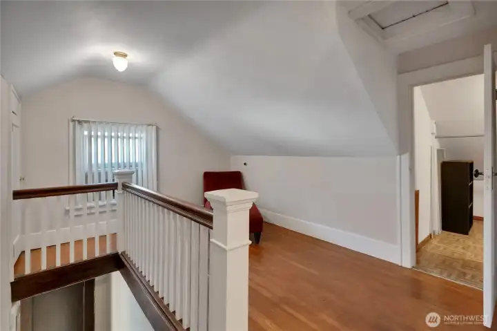 Upstairs landing w/recently refinished original hardwood floors.