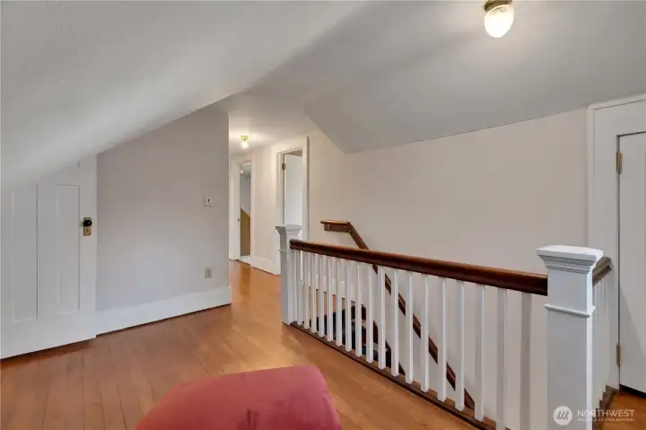 Upstairs hallway leads to 3 bedrooms and 3/4 bathroom.