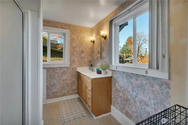 Upstairs 3/4 bathroom includes built-in storage.
