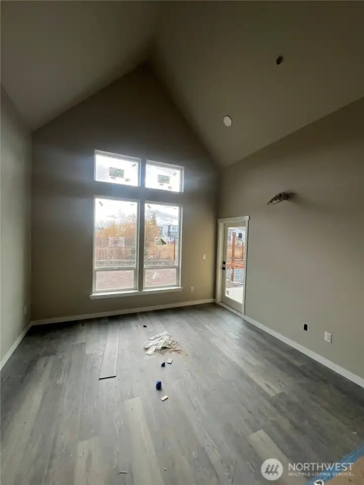 Living area with door to right leading to back patio