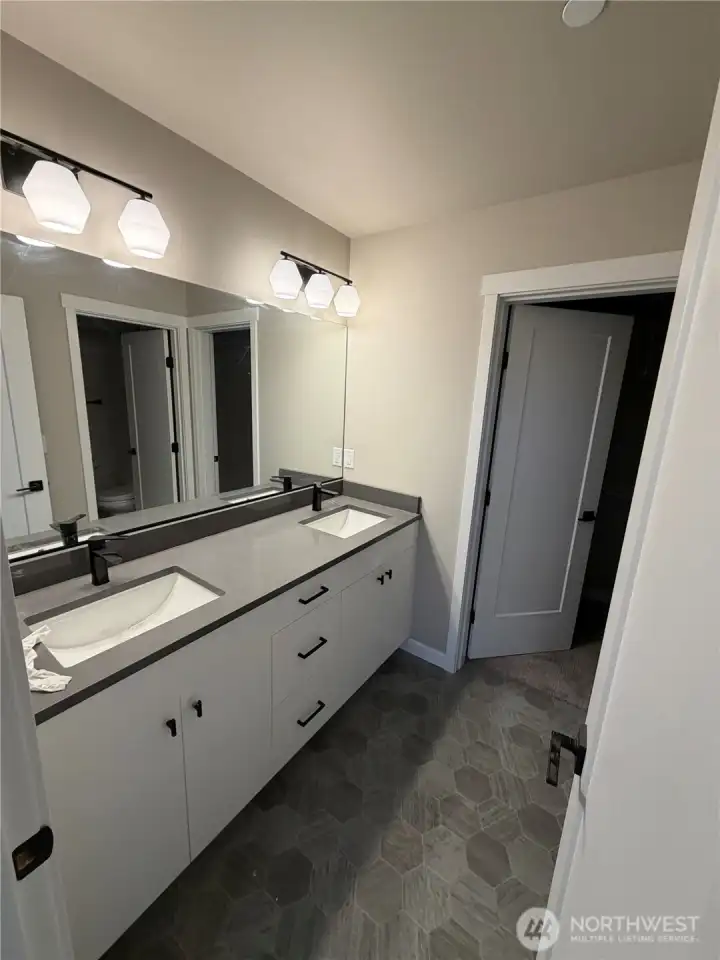 Upstairs primary bedroom ensuite with double sinks