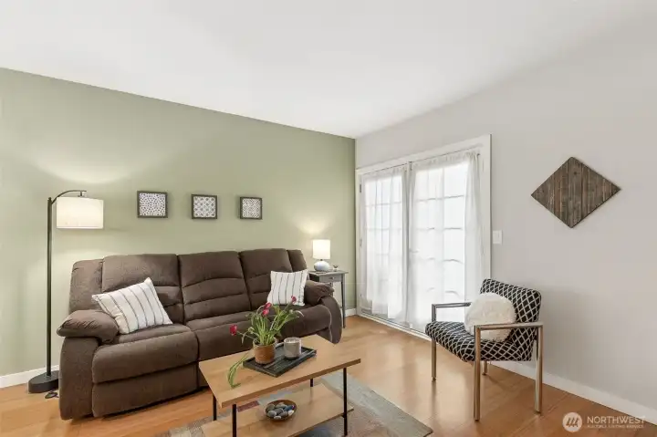 Living room area with French doors to private deck - view of Olympic mountains and sunsets!
