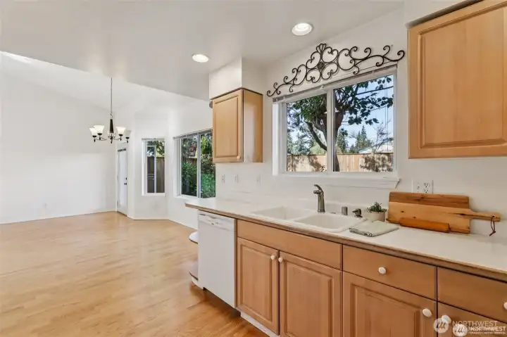Warm maple cabinets line this open kitchen with plenty of storage and counter space!