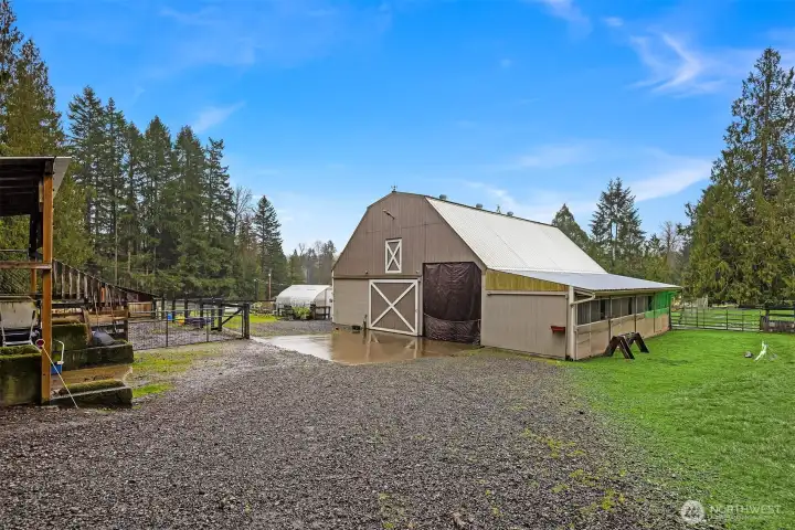 Second wood frame barn with 8 stalls and a wood shop above