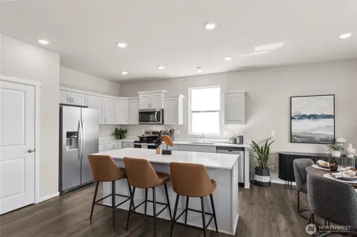 Open concept design with large pantry. Actual home is under construction. Colors, materials, and features may vary. See site agent for details.