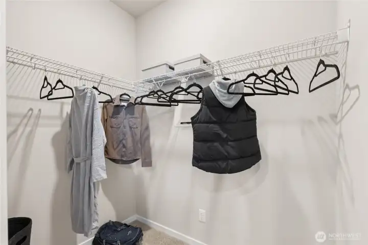 Large walk-in closet for off the primary bedroom. Actual home is under construction. Colors, materials, and features may vary. See site agent for details.