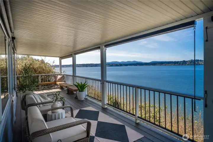 Start your day on the covered deck, where panoramic Puget Sound views create the perfect setting for morning coffee and evening sunsets.