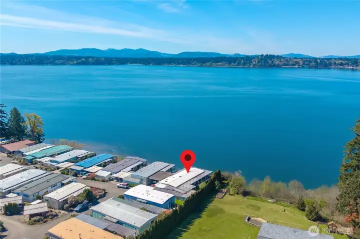 Aerial view highlights the home’s private setting within Seashore Villa, perfectly positioned just moments from the shoreline.