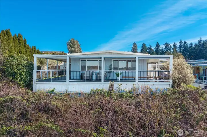 Perched above the shoreline, this home offers a front-row seat to breathtaking Puget Sound views from nearly every angle.