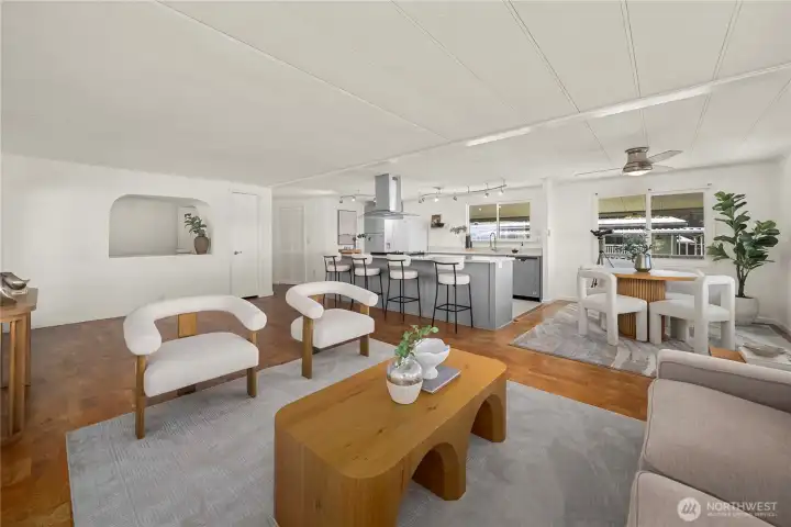 The open living space offers a warm and inviting setting, perfect for relaxing or gathering with guests.