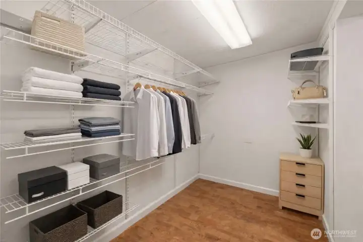 A spacious walk-in closet offers organized storage with room for everything, blending functionality with everyday ease.      (photo virtually staged)