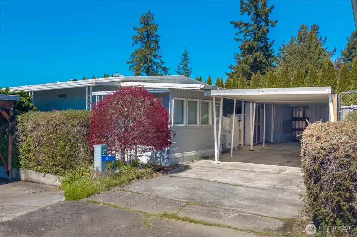 Situated on a private corner lot, this home offers added space, privacy, and a peaceful setting surrounded by mature landscaping.