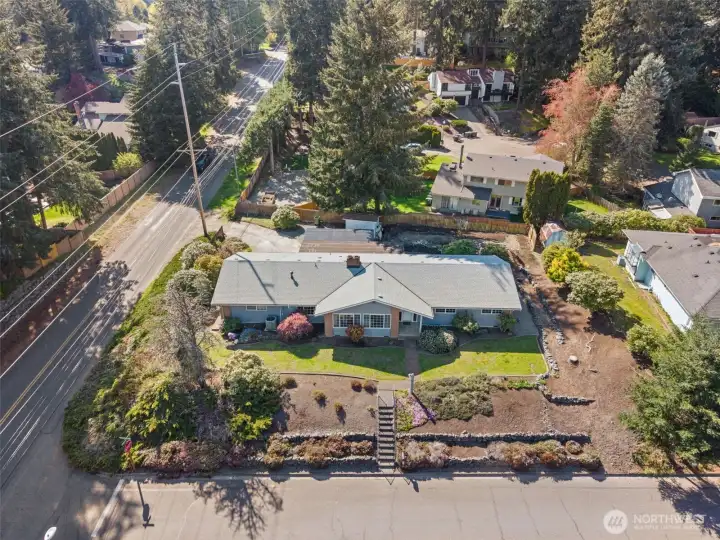 The 12,316-square-foot homesite sits on a desirable corner lot, offering just the right balance of privacy and neighborhood connection. The roof was replaced approximately 4–5 years ago, and the property includes rear access from 44th.