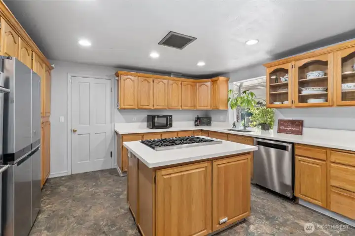 Natural wood is in! New quartz countertops are newly installed to enhance the updating Stainless appliances are all relatively new as well.