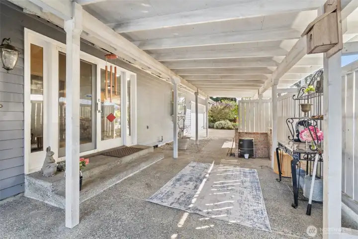 Covered patio and rear entry to the home