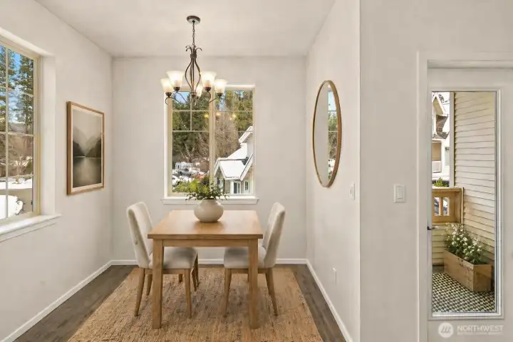 Bright and airy dining area. Virtually staged.