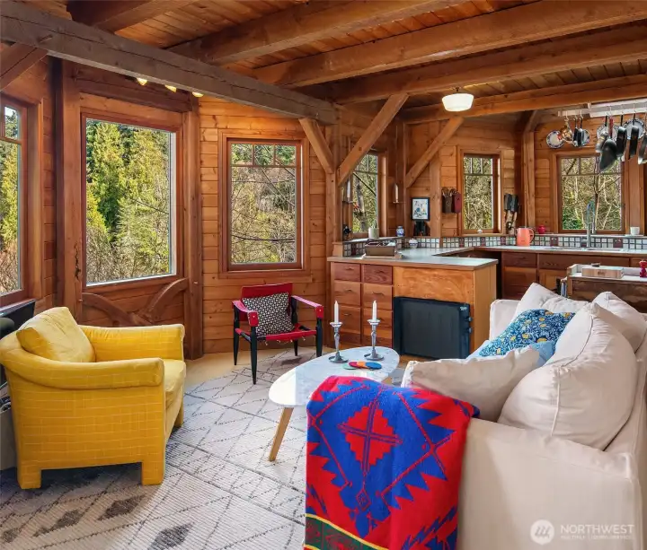 Many windows capture the light and the warm fir interior is cozy and inviting.