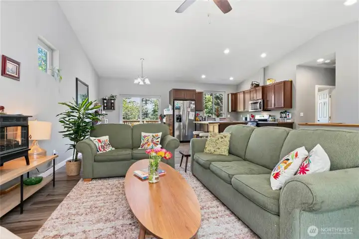 Main floor common area & kitchen w/ vaulted ceilings