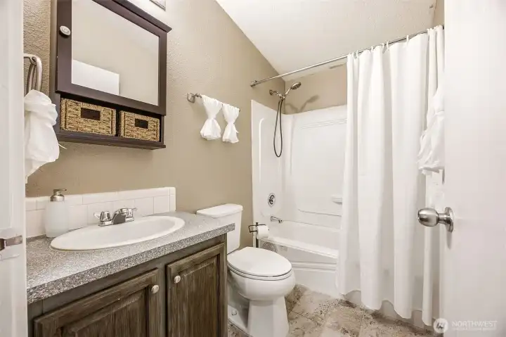 Main bath also has porcelain tile flooring. Main bath also has porcelain tile flooring.