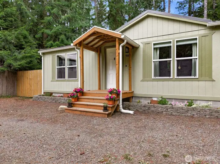 Beautiful front entry with newer roof and deck. Beautiful front entry with newer roof and deck.