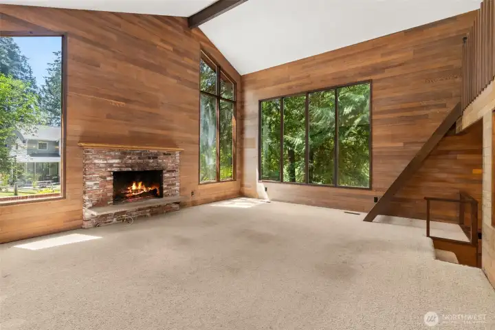 Living area is light and bright with the vaulted ceilings and large windows.