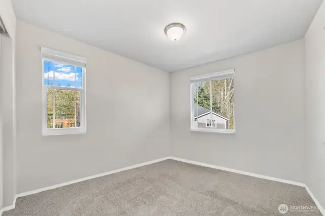 Bedroom 2 – Views of the front and side yard.