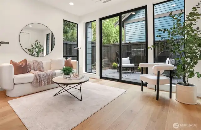 Oversized Windows and Sliding Glass Doors invite the outside in!