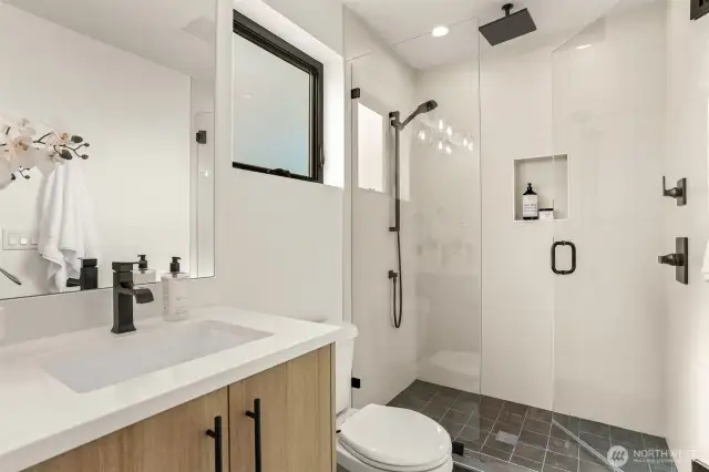 En-Suite bath for Primary Bedroom with Luxury Shower with Stone Floor, Rain Head, Built-In and Handheld
