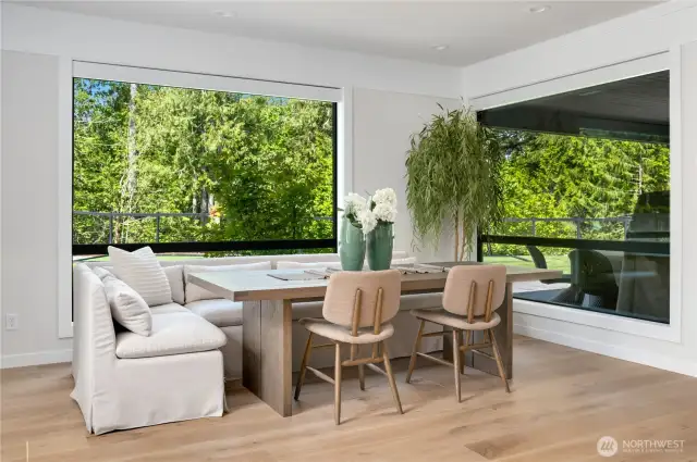 Eating area for numerous guests & double views to the grounds to bring all the action and light in