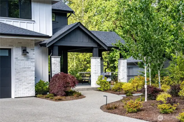 Welcoming covered, generous entry w/covered patio area.