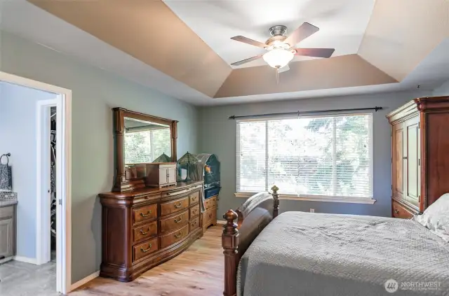 Larger of the two upper floor primary suite.  Coffered ceilings.