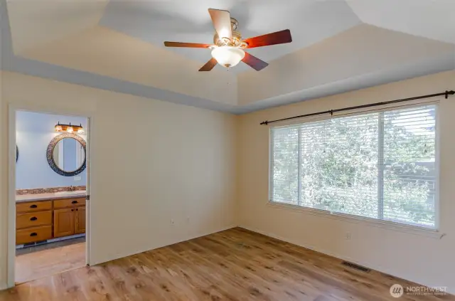 Upper level primary suite has a 5 piece bath