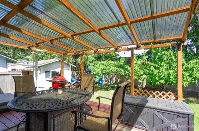 Back deck has room for seating  and access to the hot tub, that comes with the house.