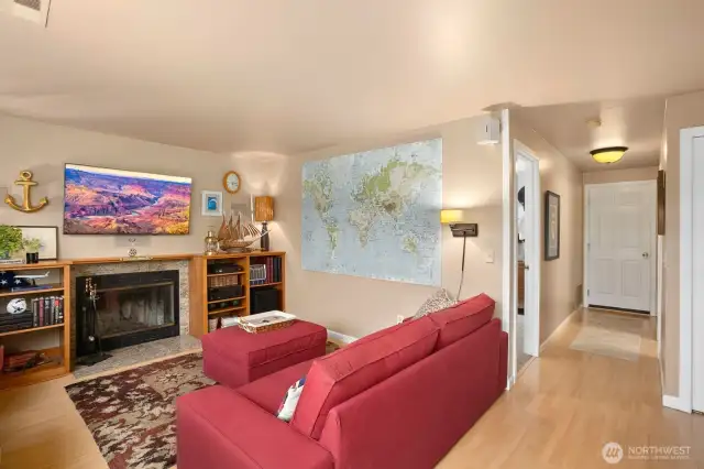 Lower-Level Bonus Room. Warm and inviting bonus room featuring a fireplace, built-in shelves  Warm and inviting bonus room featuring a fireplace, built-in shelves, and space.