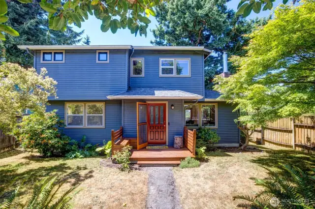Inviting porch and fenced yard welcome you in