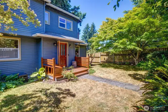 Level yard with mature landscaping
