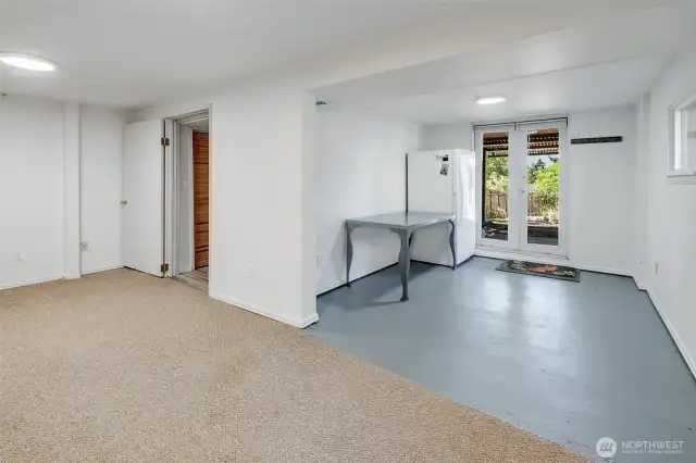 French doors lead to a shady area beneath the deck
