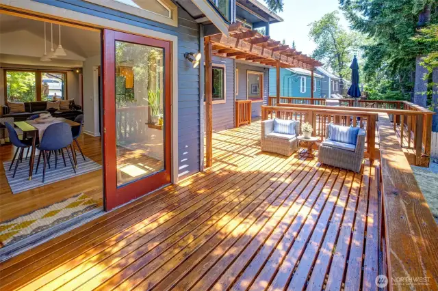 Recently refinished deck provides a couple areas to relax on - either in the sun or the shade beneath the fir tree