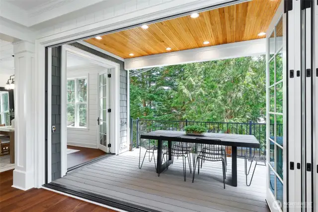 Folding glass doors that open out to to the deck