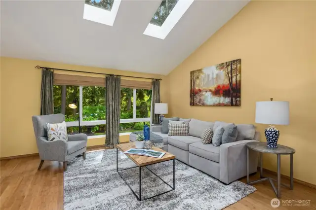 Large windows showcase abundant backyard space.
