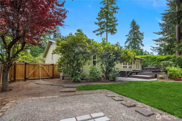 Fence opens wide for easy access to backyard.