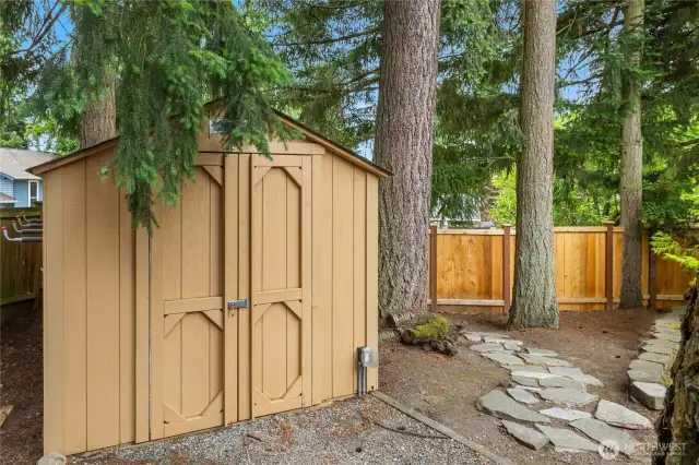 Large storage shed and two smaller ones all convey.