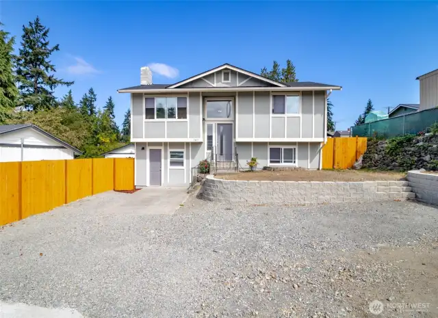 Welcome Home! New roof, lots of parking and very low maintenance yard